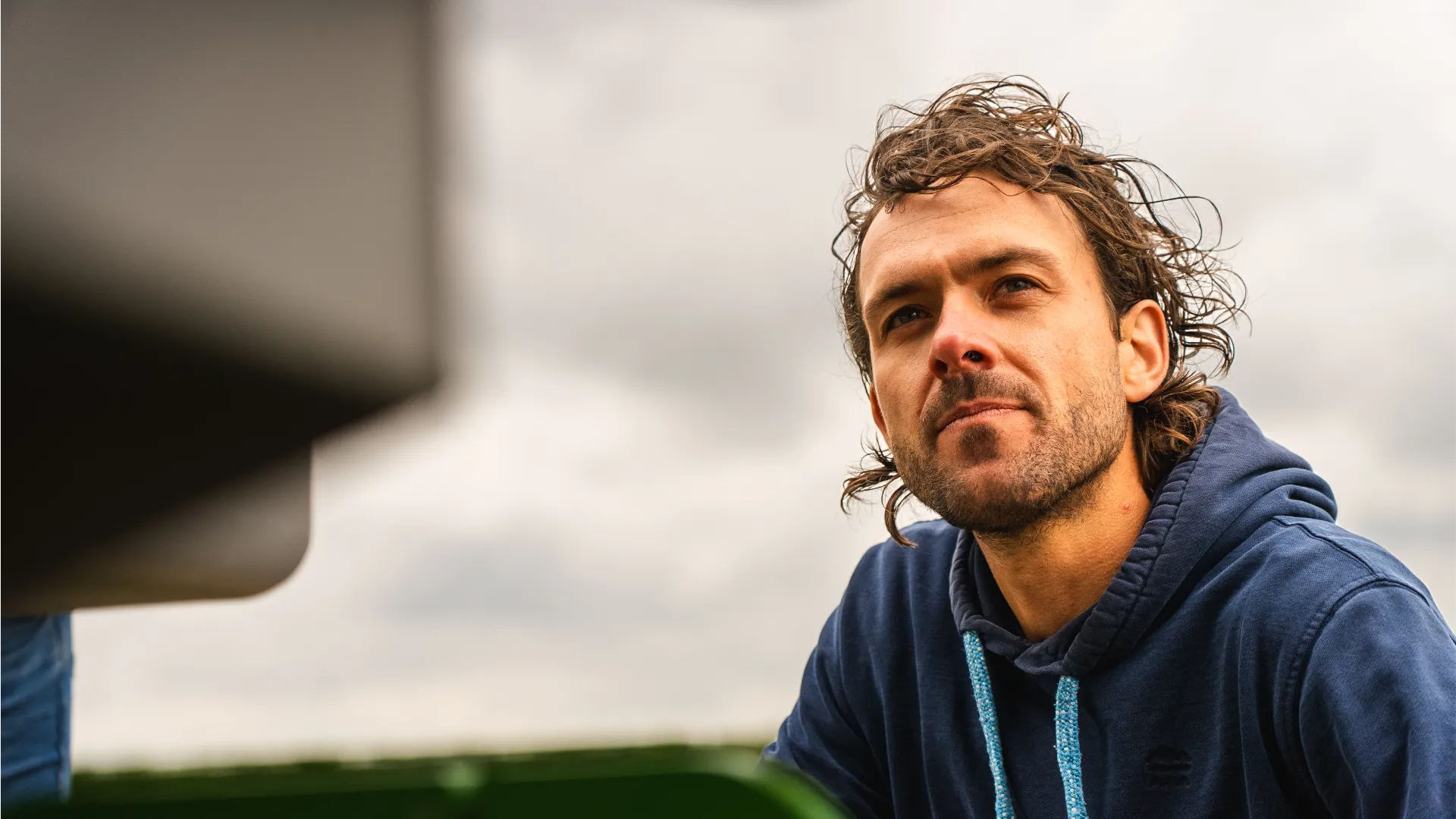 Jack Simons looking into the horizon with FarmDroid FD20 in the foreground