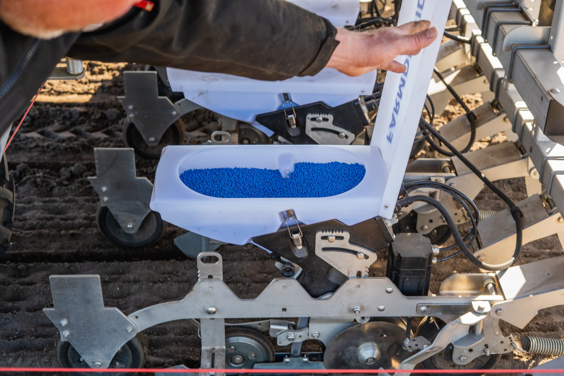 Seed container open on FarmDroid FD20 while seeding fodder beet