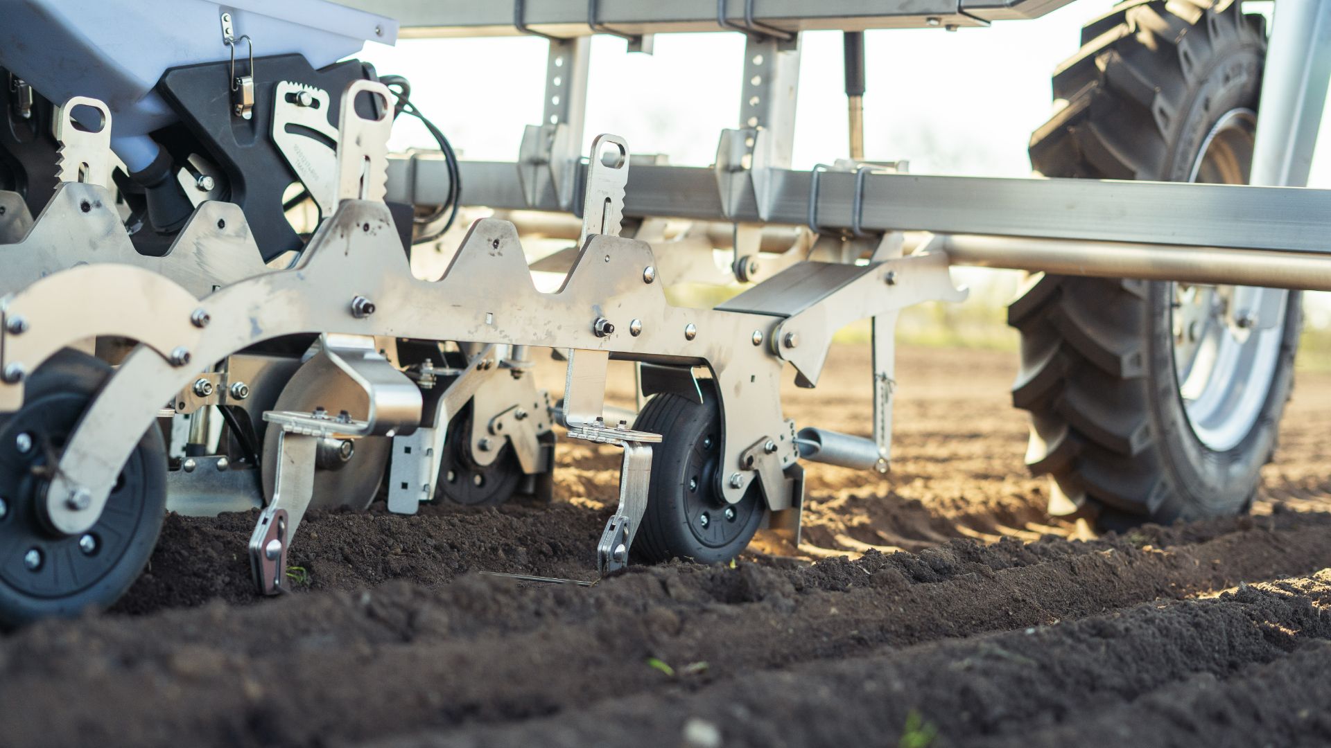Dual Front Wheel farmdroid weeding in soil with tools