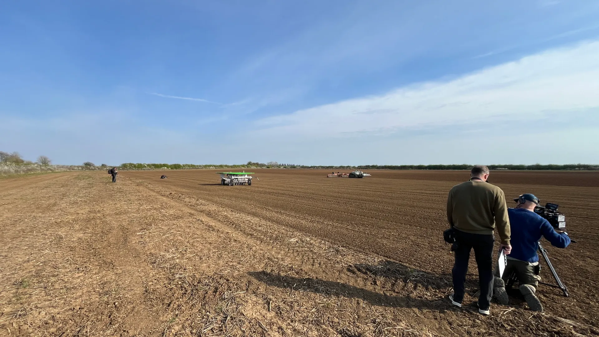 FarmDroid FD20 on a field with Clarksons farm crew in front