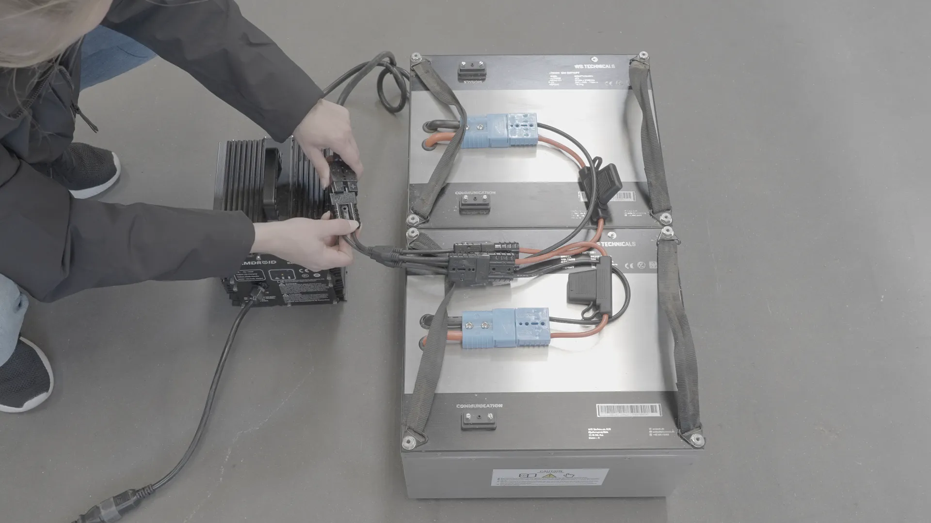 Power Bank on floor being connected to charger